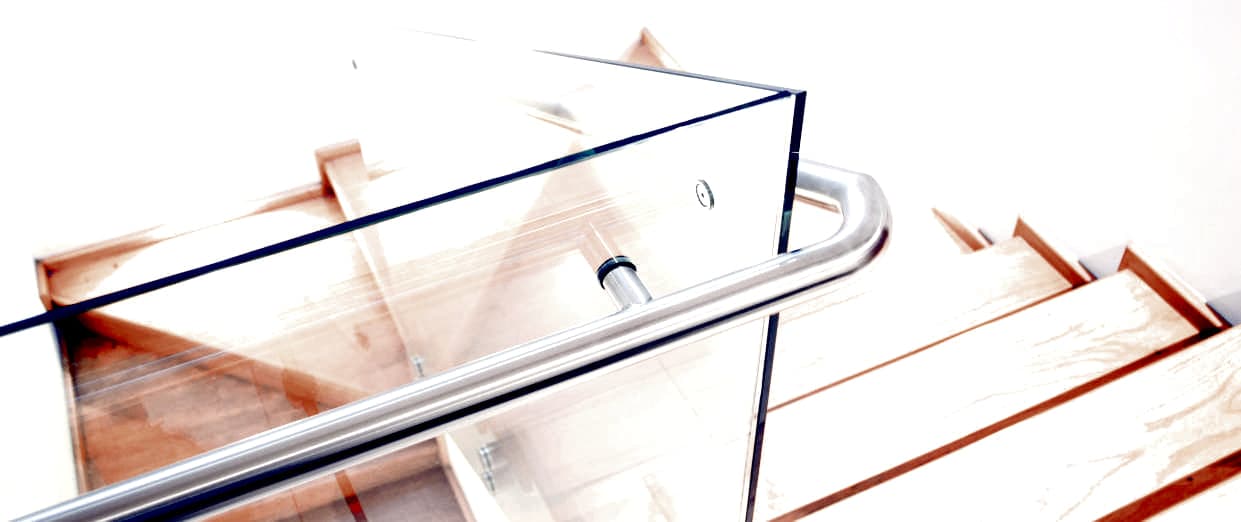 Glass balustrade with a stainless handrail