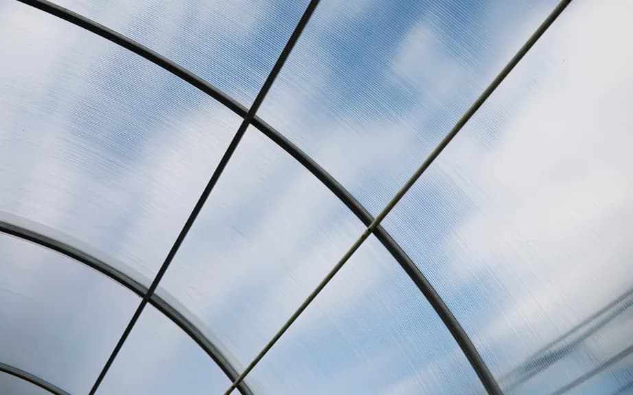 Polycarbonate roof glazing on a curved frame