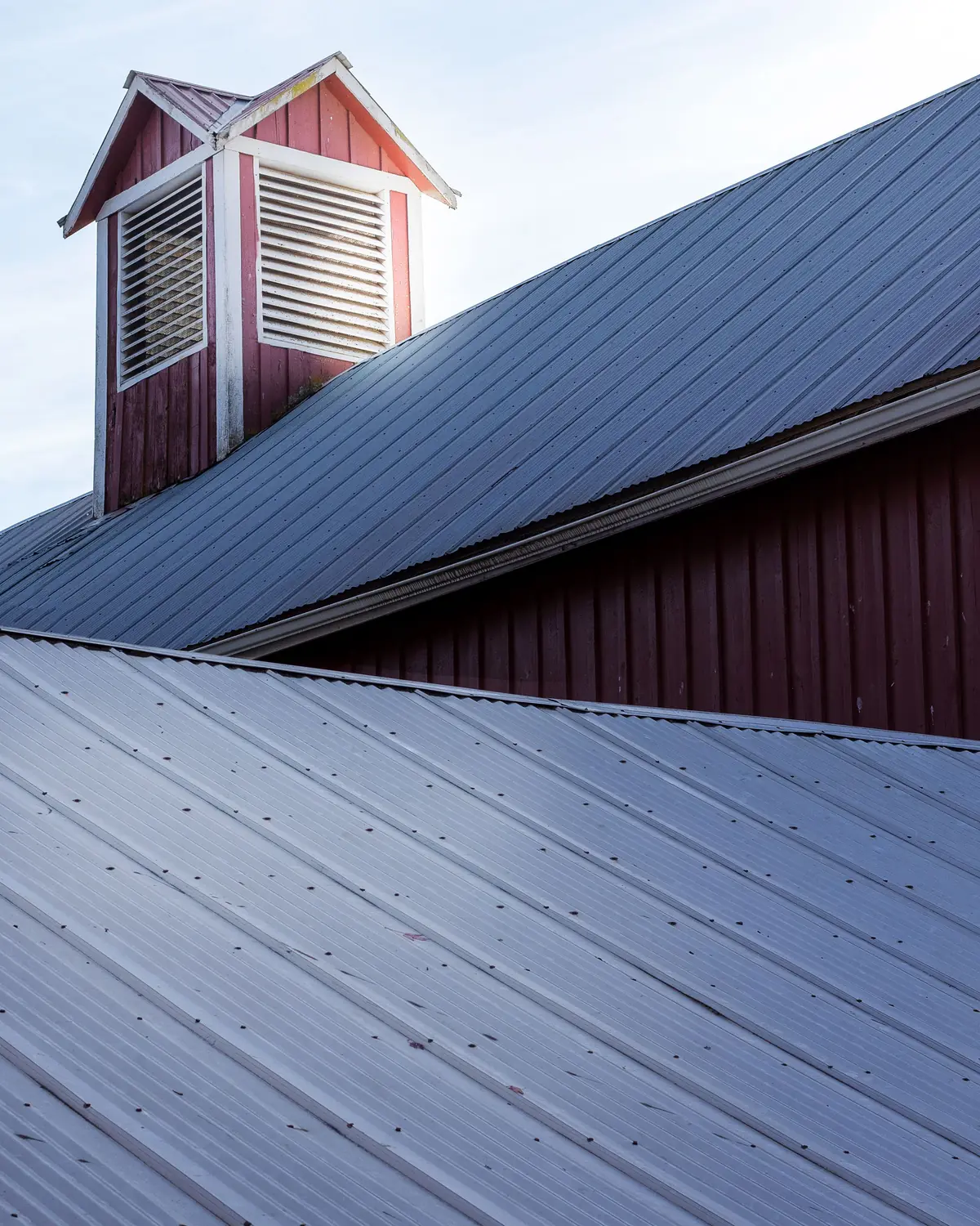 Ridge detail and roof vent on a profiled metal roof