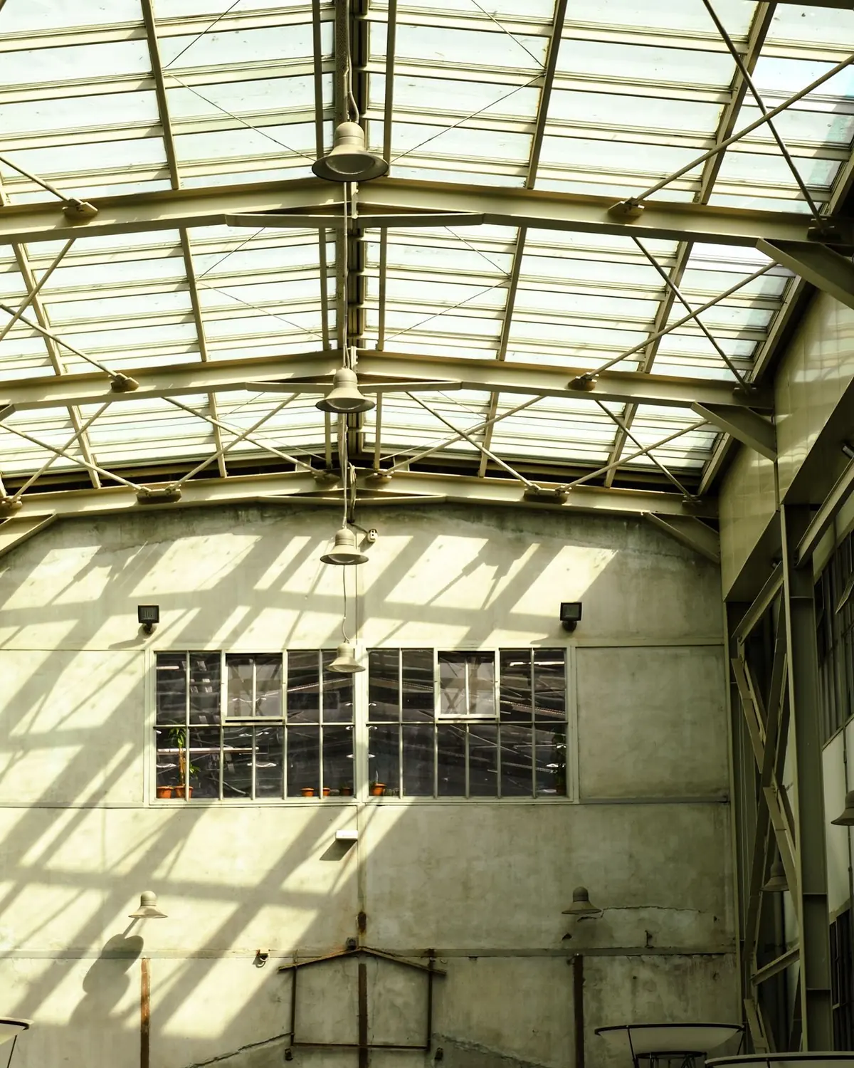 Daylight through the glazed curved roof of an industrial hall