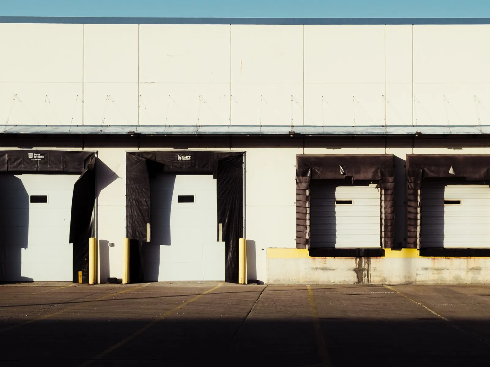 Loading dock lined with industrial bay doors