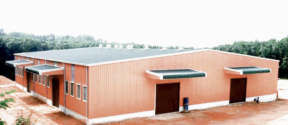 Pre-engineered industrial building with profiled steel cladding