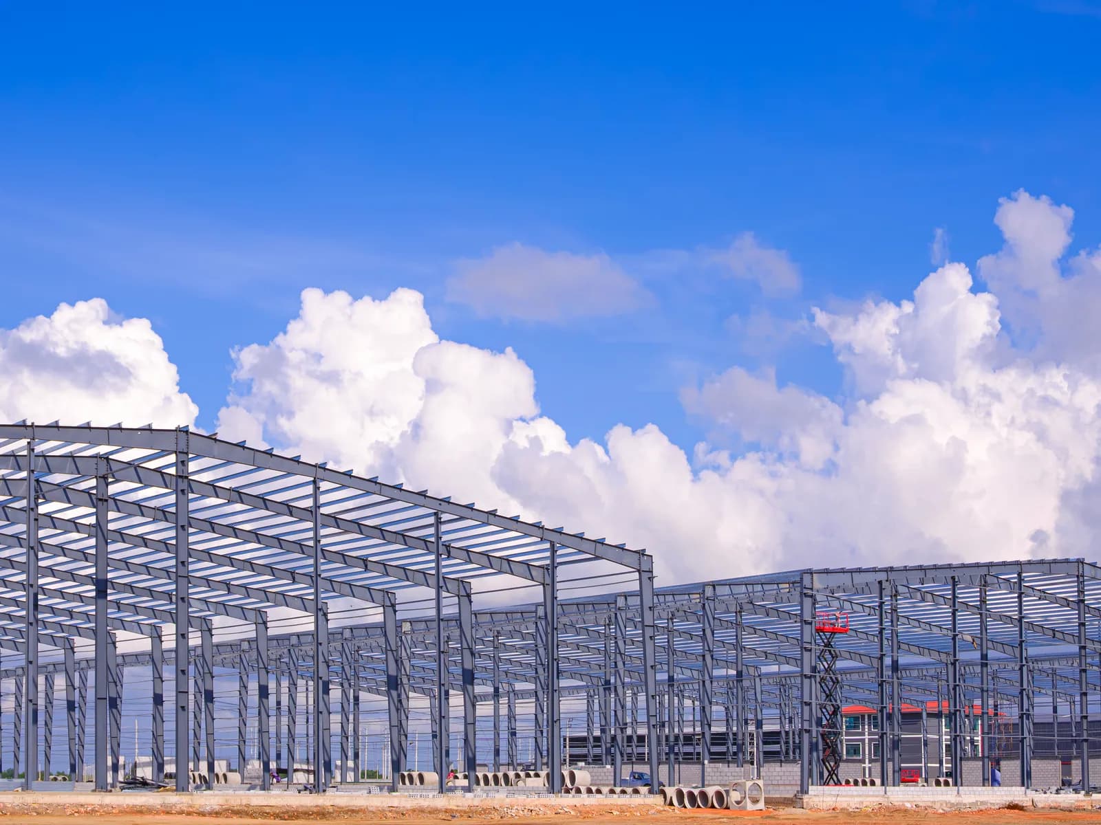 Pre-engineered steel portal frames erected across two warehouse bays